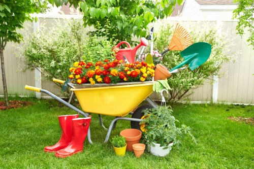 Garden maintenance in Somers Town with tidy planting beds and a neat urban patio